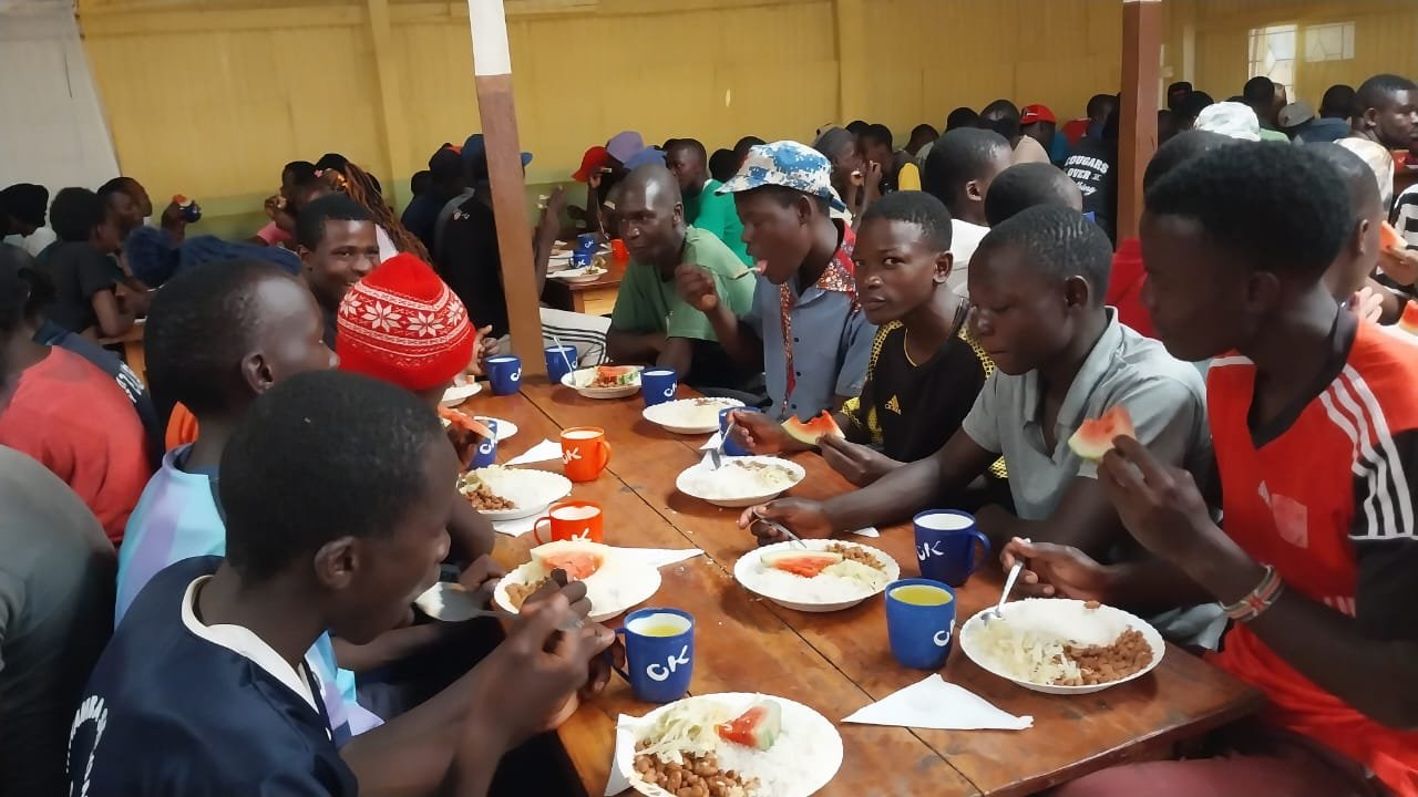 Children sharing a meal at Grace Calvary Ministries