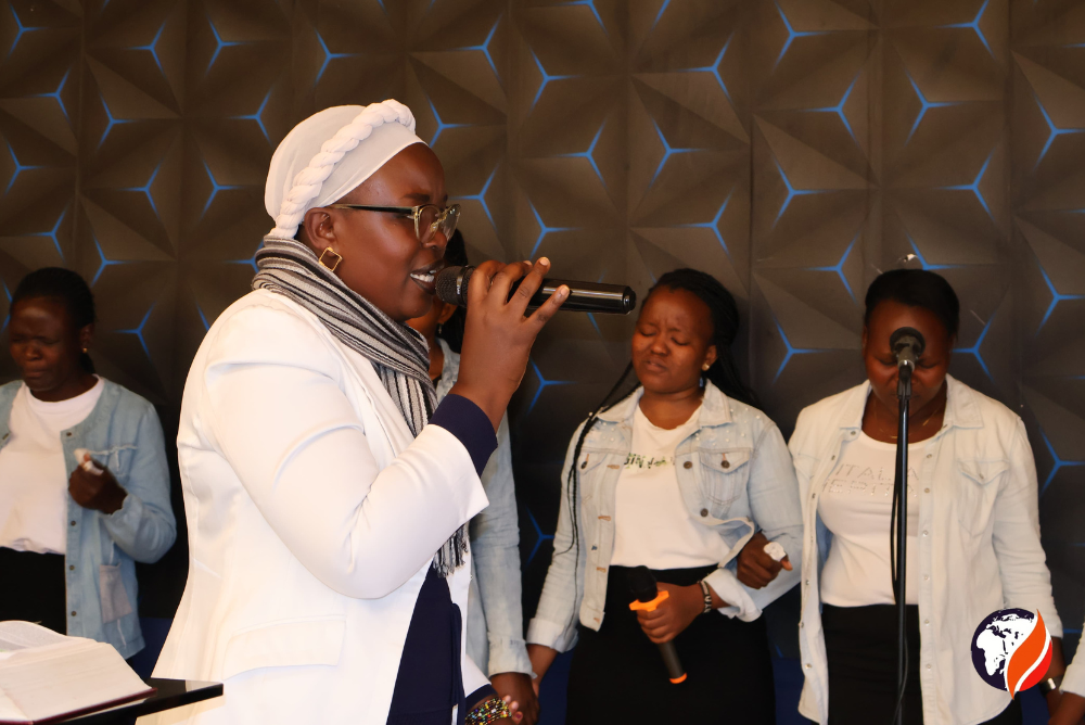 Intercessor Caren Kisembi leading prayers